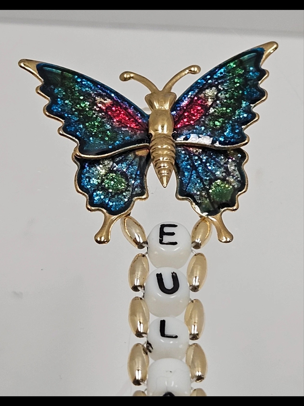 Source Unknown Gold Butterfly Brooch with Multicolor Glitter Wings